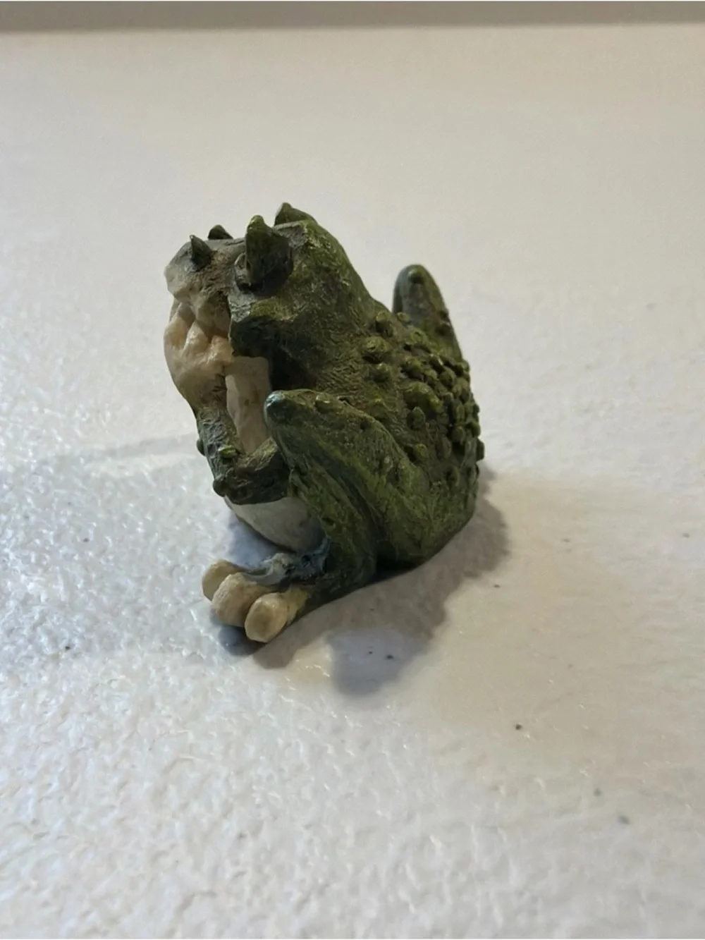 Porcelain Frog Statue 1 inch tall With A Goofy Look On His Face